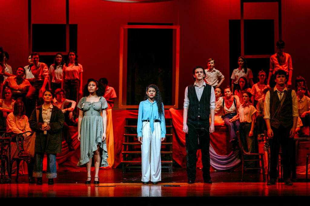 (From left) senior Sophie Ryan as Eurydice, senior Shiloh Adams as Persephone, senior Alexandra Tsikouris as Hermes,freshman Ryan Clark as Hades, and senior Evan Ruggirello as Orpheus stand on stage. Photo by Alana Jordan