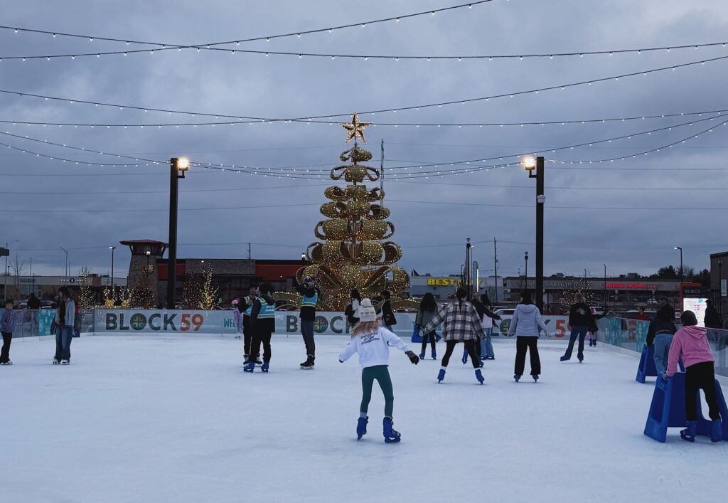 Naperville families ice skating at The Rink. Photo Credit: Ashley Elliott.