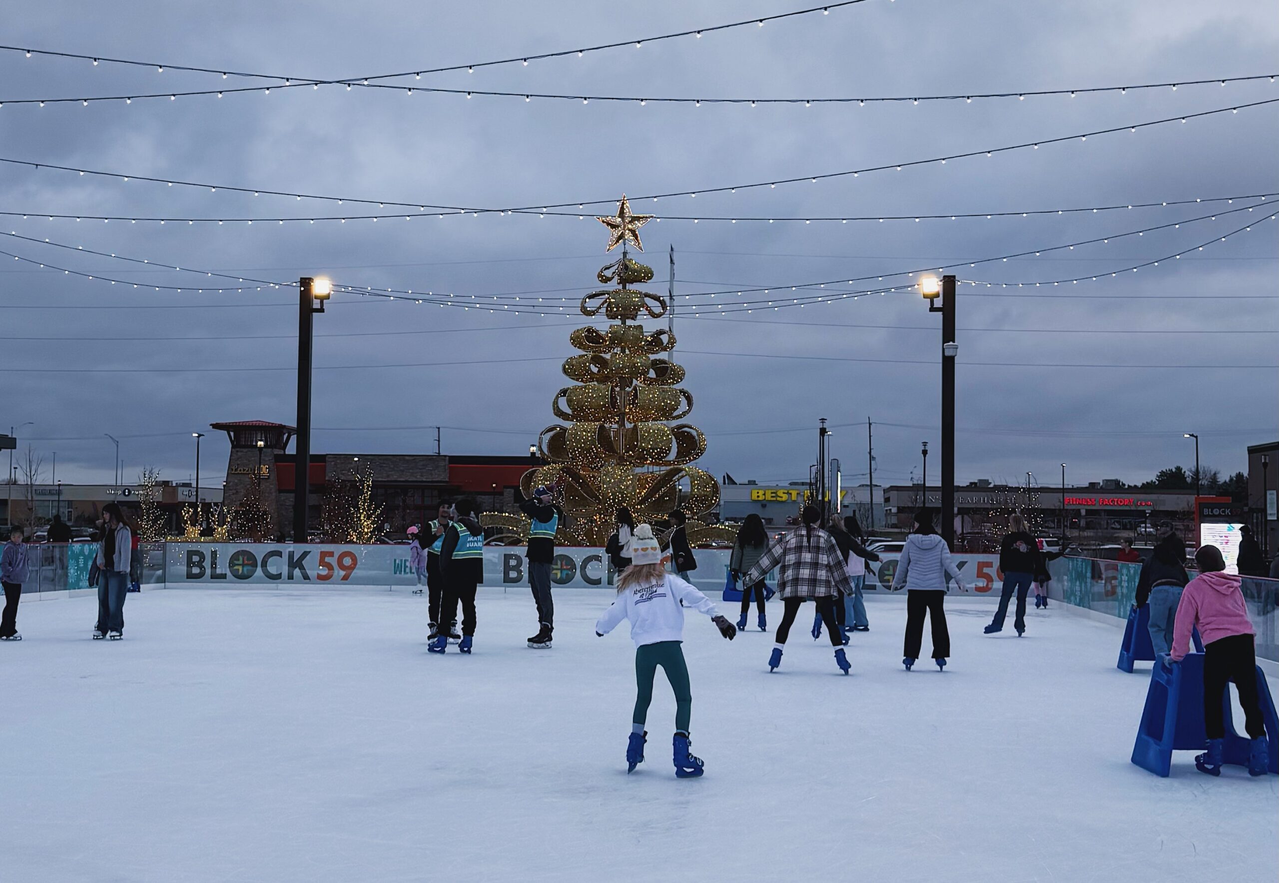 Naperville families ice skating at The Rink. Photo Credit: Ashley Elliott.