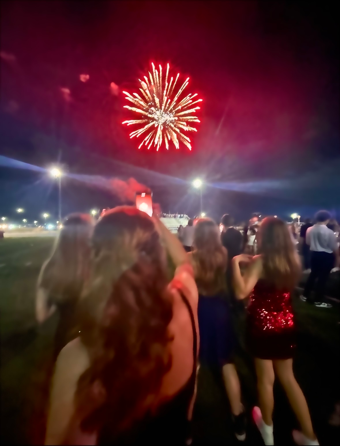 Students at 2025 Homecoming watch the fireworks, spectacular. Photo By: Rose Carr