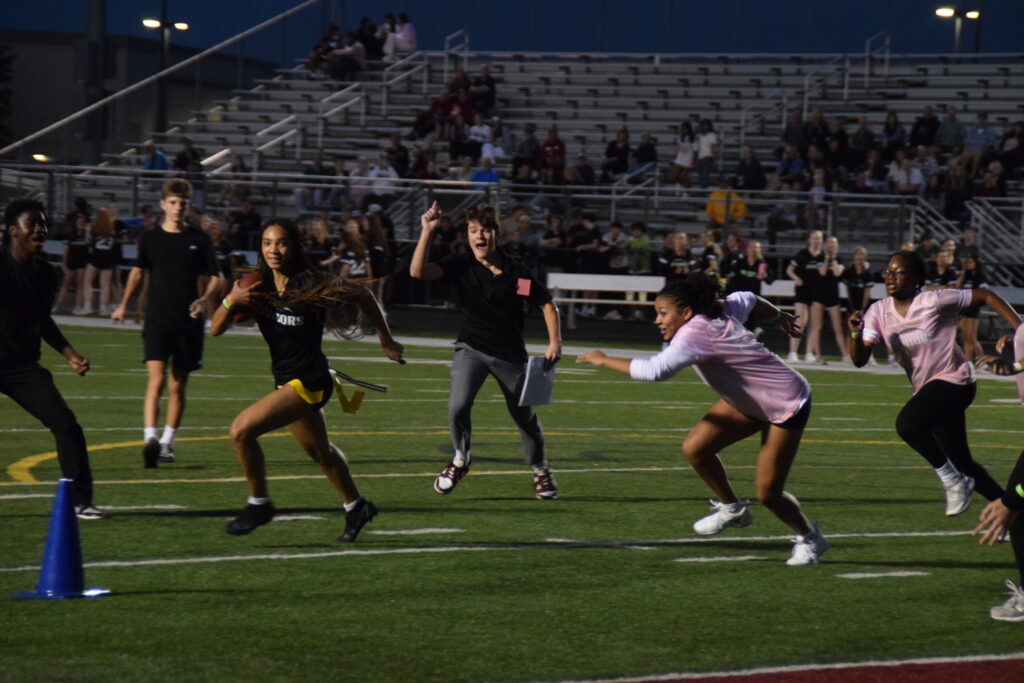 Shiloh Adams chasing after Kaiya Bradshaw. Photo Credit: Lucius Castro.