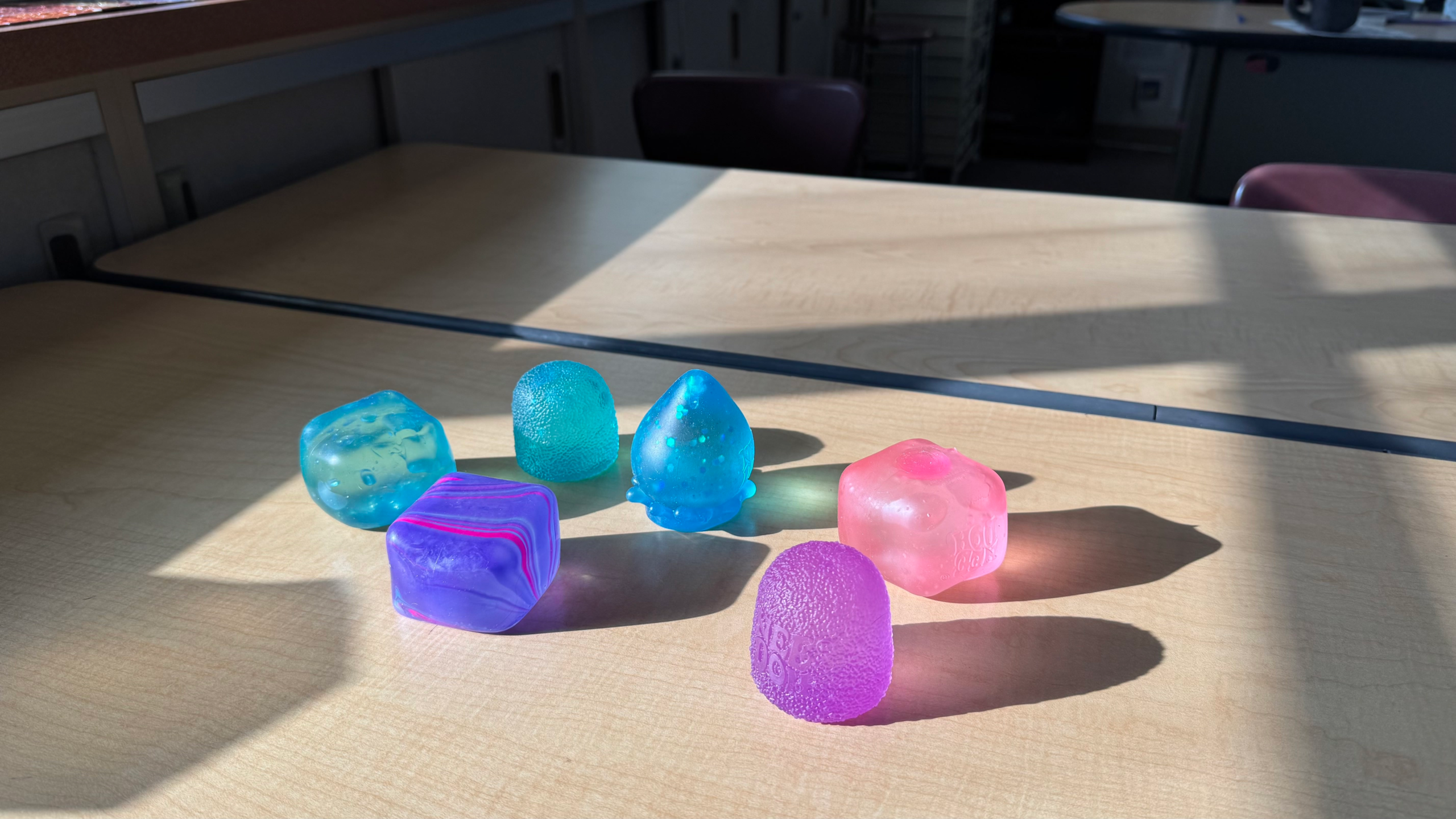 A collection of NeeDohs belonging to students, including the NeeDoh Nice Cube, NeeDoh Gum Drop, and NeeDoh Dream Drop. Photo by Lily Allen.