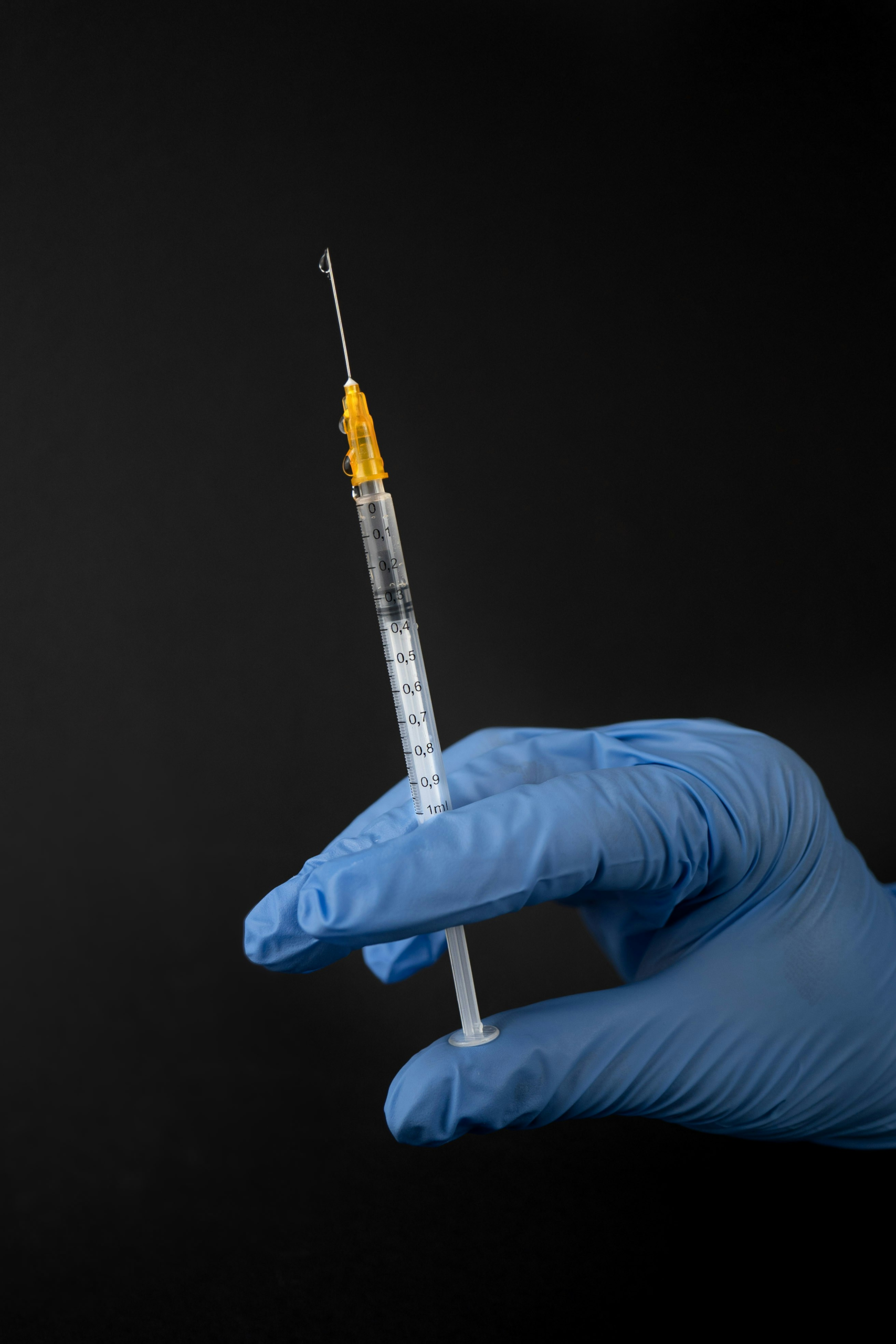 Person holding vaccine. Phone Credit. unsplash