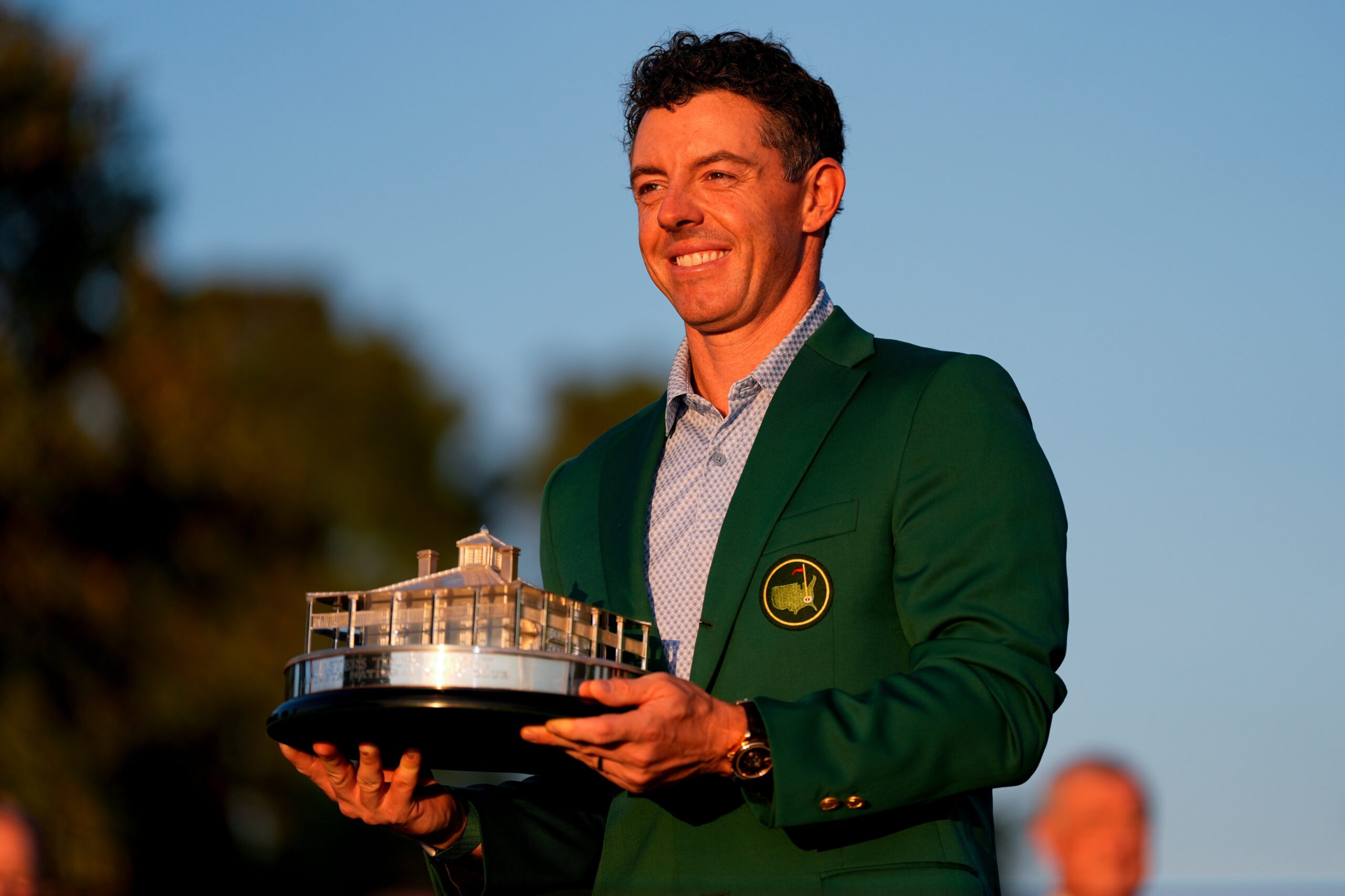 Rory McIlroy, of Northern Ireland, holds the trophy after winning the Masters golf tournament at the Augusta National Golf Club. Photo by Ashley Landis